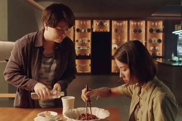 A scene from the movie Parasite, where the main character is eating a bowl of Chapaguri
