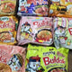 A series of viral Buldak ramen on a table with different flavors