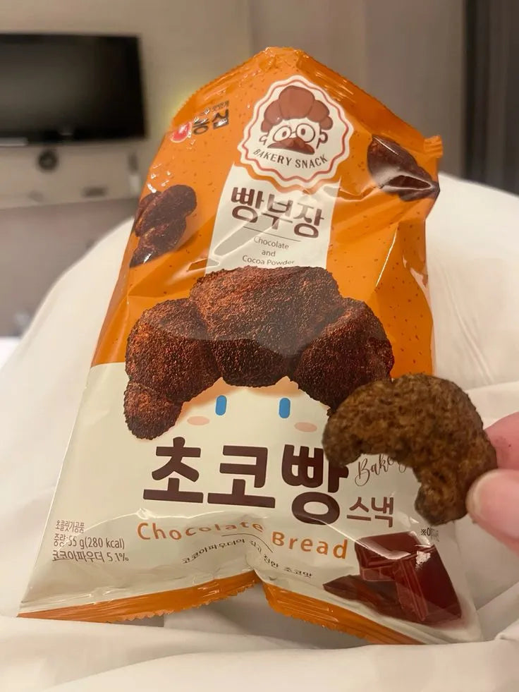 Packaged chocolate bread snack with a visible brand logo on a white surface.